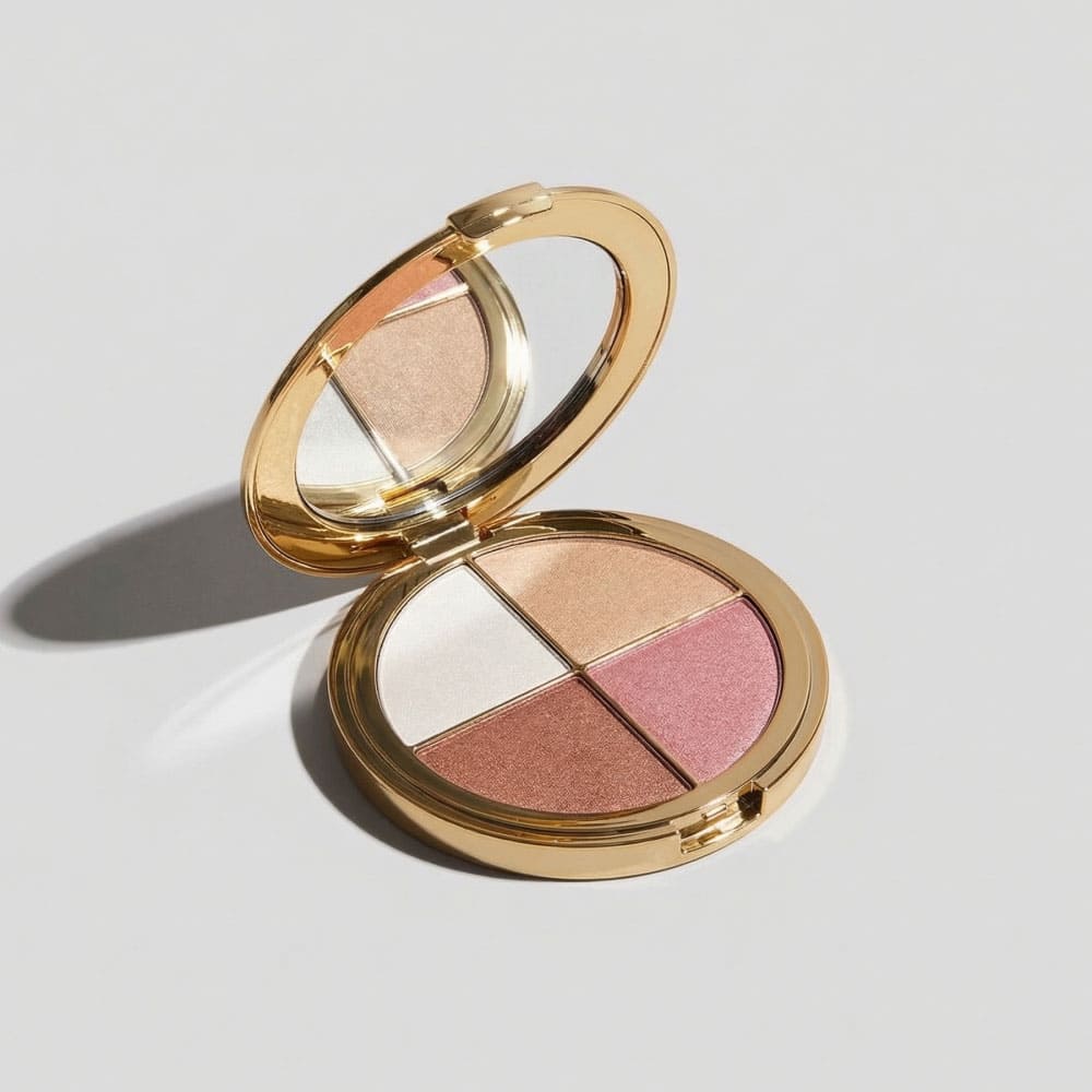 Makeup compact with four shades of blush on a light gray background